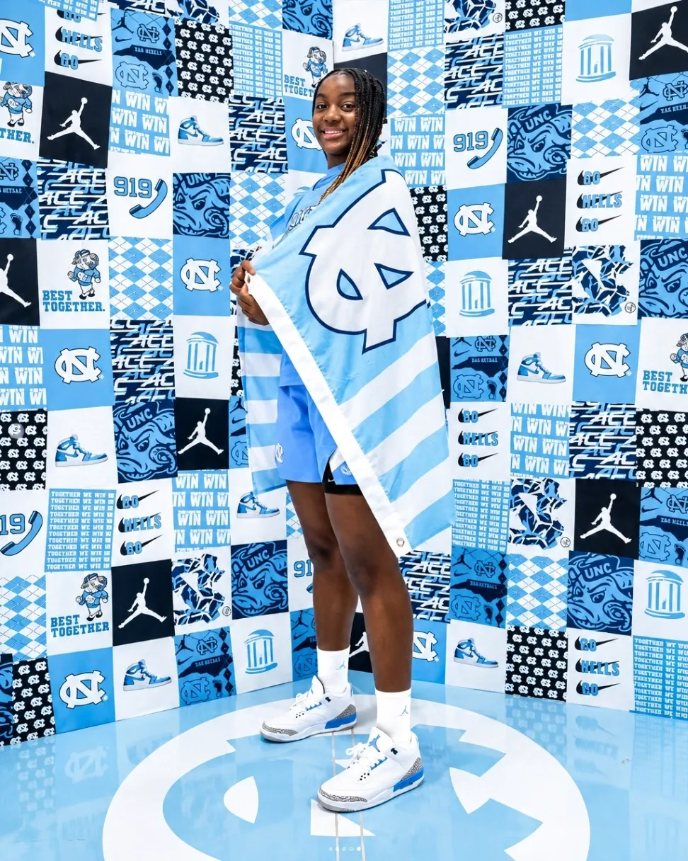 Noelle Bofia wrapped in a North Carolina flag